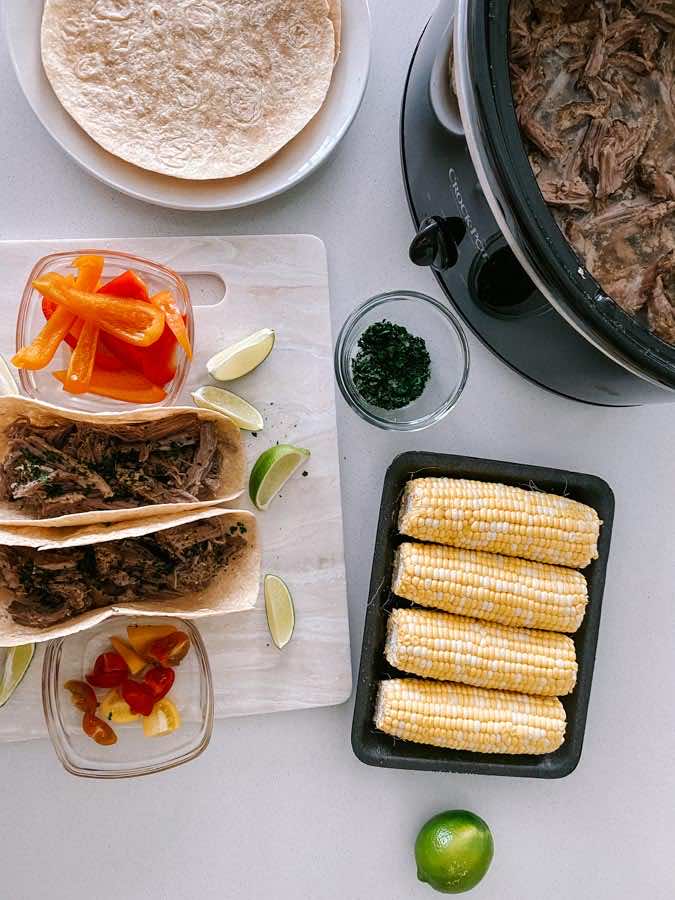 The Juicy Slow Cooked Pork Carnitas are perfect for any night of the week! Make the carnitas into a taco, burrito or a carnita bowl.