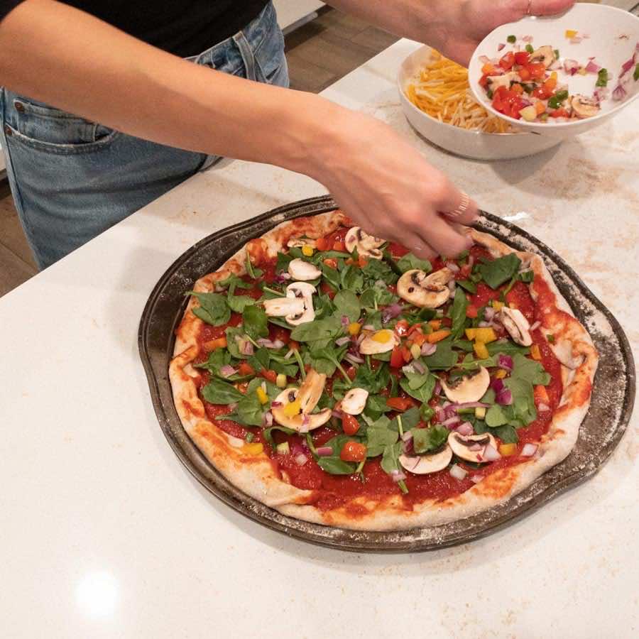 This Homemade Pizza Dough creates a light and fluffy crust, perfect for any pizza night! Just add the toppings of your choice and enjoy!