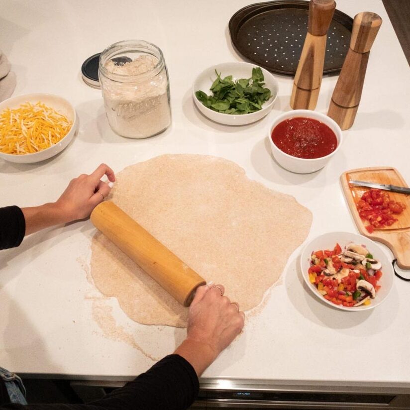 This Homemade Pizza Dough creates a light and fluffy crust, perfect for any pizza night! Just add the toppings of your choice and enjoy!