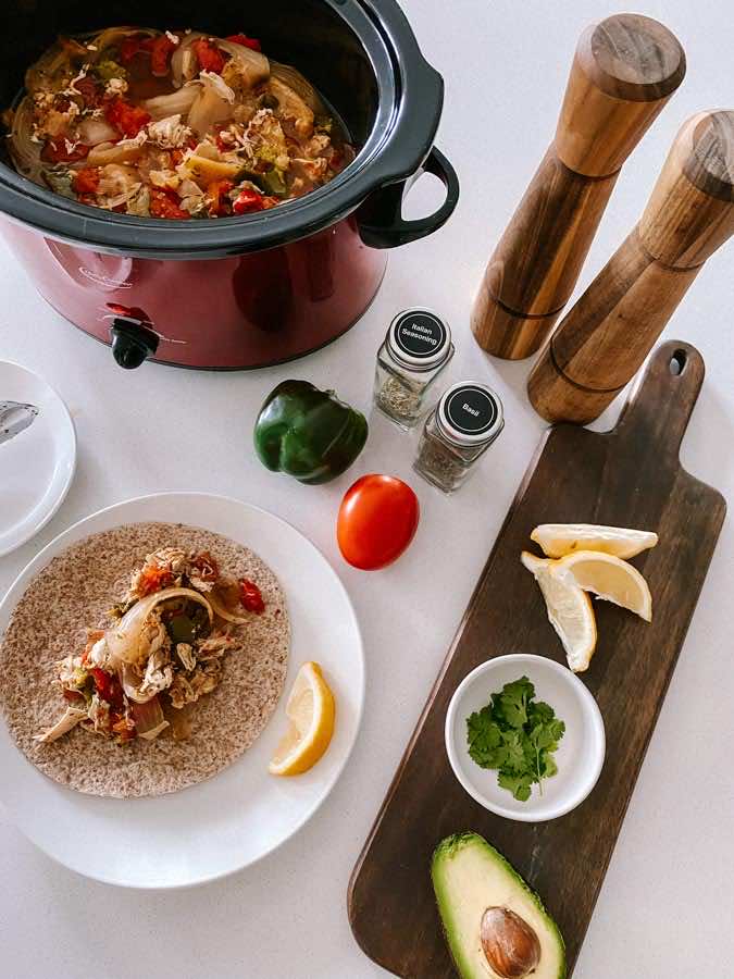 This Slow Cooker Chicken Fajita is an easy, yet delicious meal to make during those busy weeks. Just dump all the ingredients into a slow cooker, stir every few hours, and you have a meal ready to go!