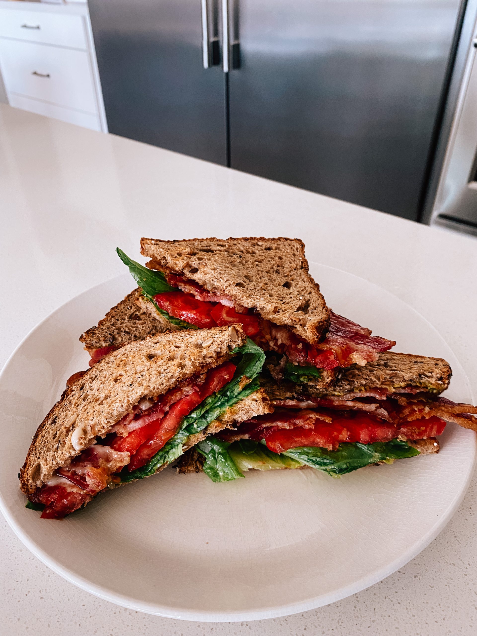 The Best BLAT Sandwich Ever with toasted bread with piled high with juicy tomatoes, fresh avocado, and crispy bacon. 