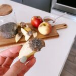 Apple Dipped in Nut Butter and Chia Seeds - a quick and nutritious snack.